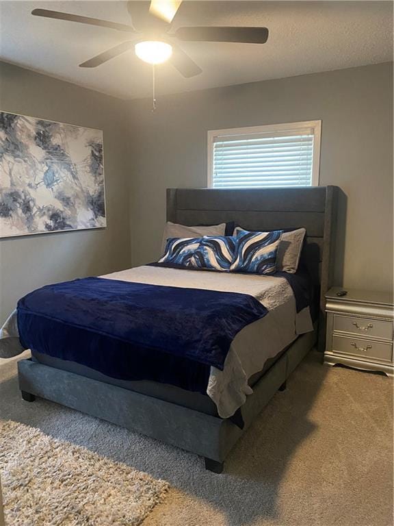 carpeted bedroom featuring a ceiling fan