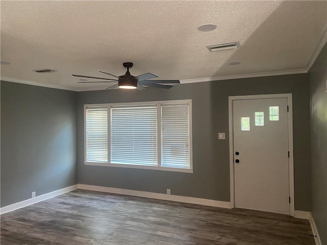 entrance foyer with ornamental molding and wood finished floors