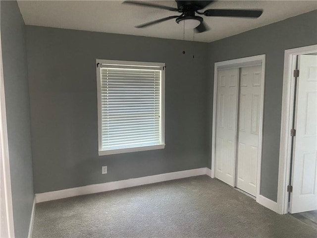 unfurnished bedroom featuring a closet, carpet flooring, a ceiling fan, and baseboards