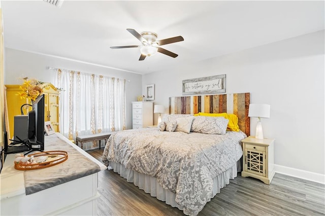 bedroom with wood-type flooring and ceiling fan