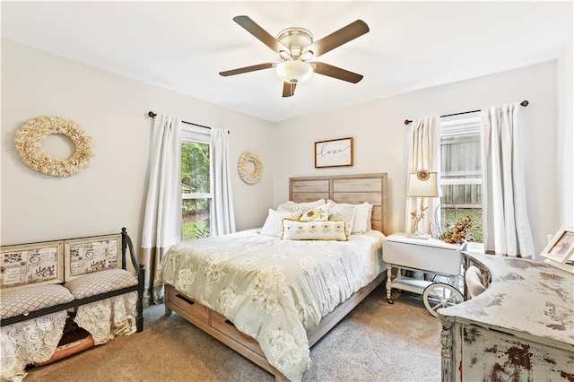 carpeted bedroom featuring ceiling fan