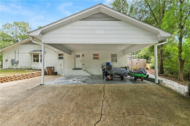 rear view of property with a carport