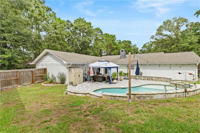 view of pool featuring a patio, a gazebo, and a yard