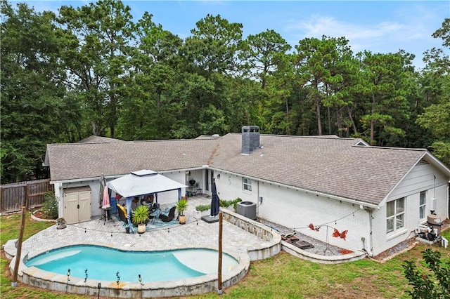 back of property with a patio and central air condition unit