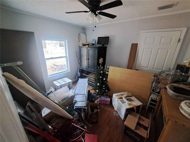 interior space with visible vents, ornamental molding, wood finished floors, a textured ceiling, and a ceiling fan