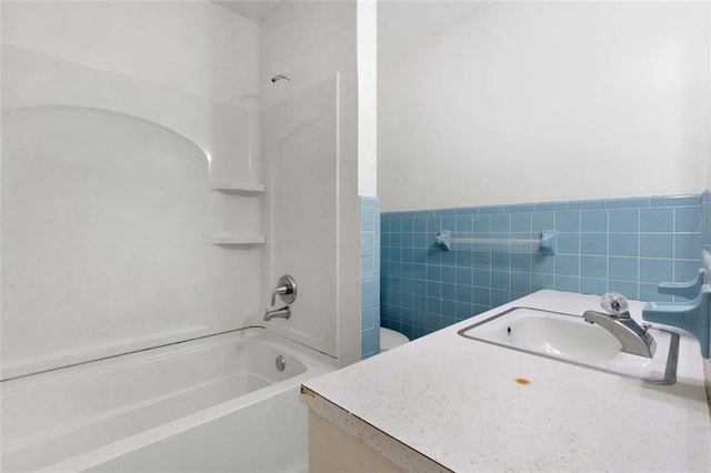 full bathroom with vanity, toilet, and shower / washtub combination