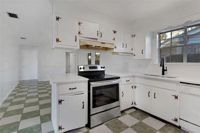 kitchen featuring white dishwasher, sink, stainless steel electric range oven, a healthy amount of sunlight, and white cabinetry