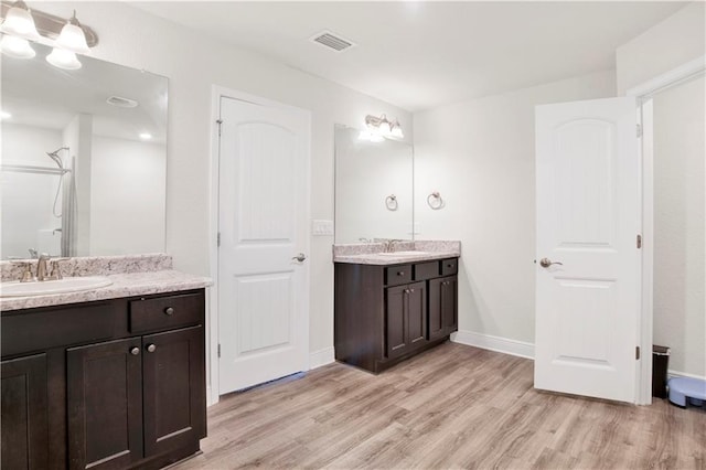 bathroom featuring hardwood / wood-style flooring and vanity