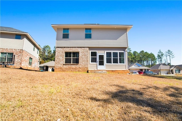 rear view of property with cooling unit and a lawn