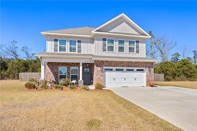 craftsman inspired home with brick siding, a front yard, and fence