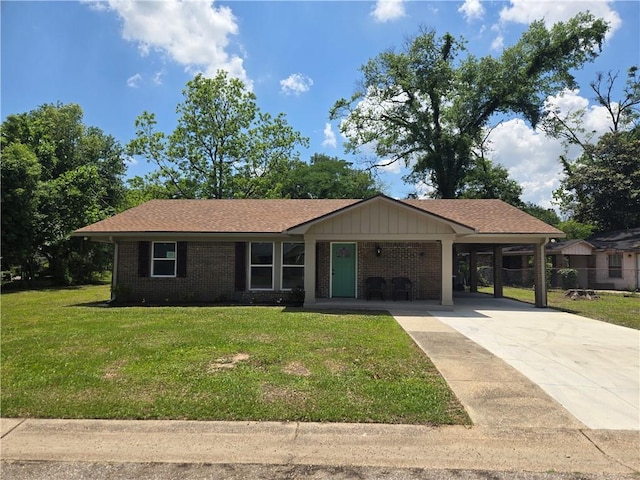 2253 Downs Ct, Mobile, AL 36617 - ranch-style home featuring brick siding, a front lawn, an attached carport, and concrete driveway