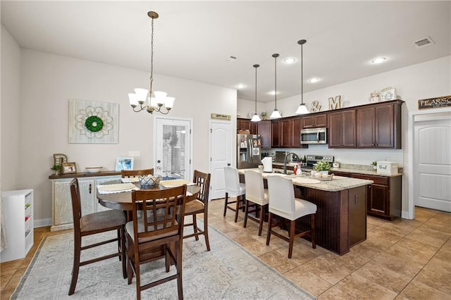 dining area with a chandelier, recessed lighting, visible vents, and light tile patterned floors