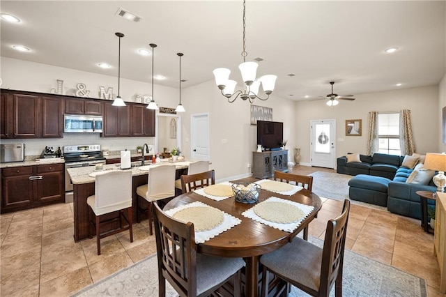 dining area with light tile patterned floors, recessed lighting, ceiling fan with notable chandelier, visible vents, and baseboards