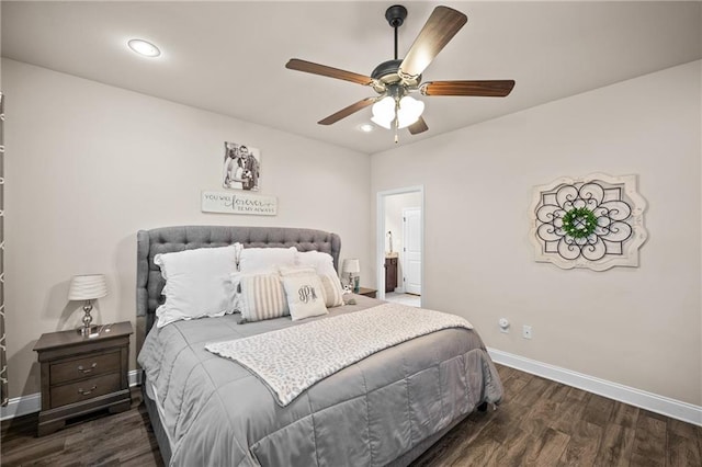 bedroom with a ceiling fan, baseboards, and wood finished floors