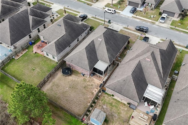 birds eye view of property with a residential view