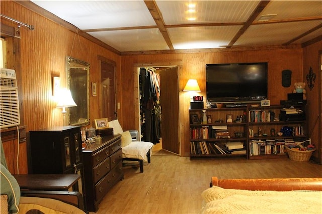 living area with wood walls and wood finished floors