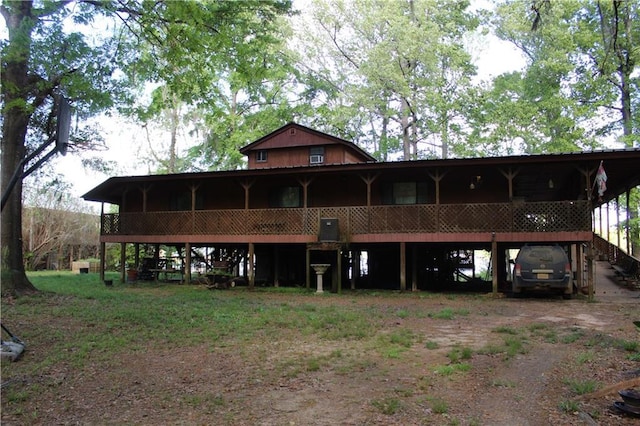 back of property featuring metal roof