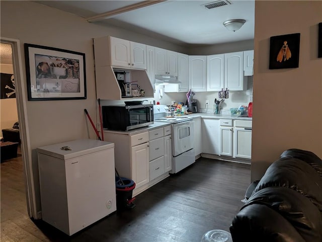 kitchen featuring white cabinetry, fridge, and white range with electric stovetop