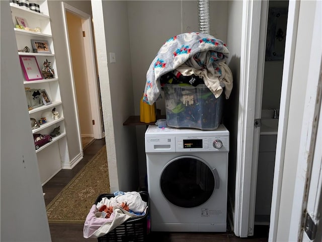 laundry room with washer / dryer and dark hardwood / wood-style floors