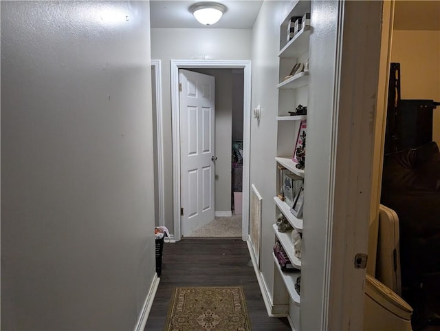 hallway featuring dark hardwood / wood-style floors