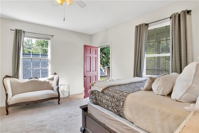 bedroom featuring ceiling fan and light carpet