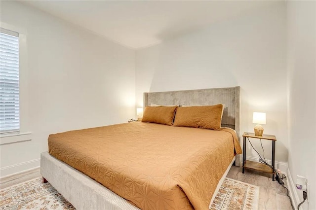 2711 Briley St, Mobile, AL 36606 - bedroom with light wood-style floors and multiple windows