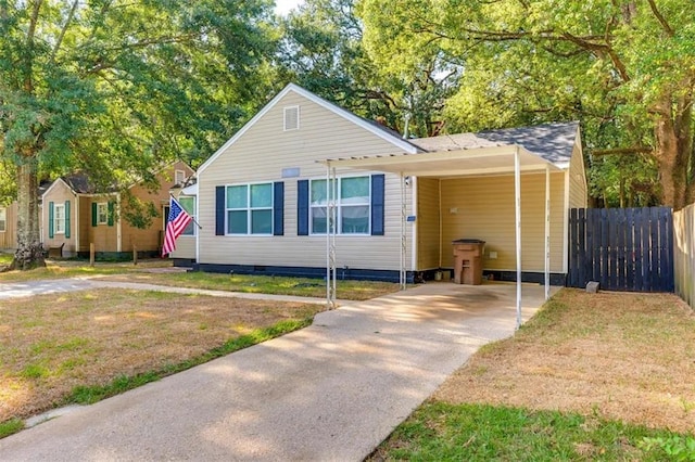 2711 Briley St, Mobile, AL 36606 - view of front facade with concrete driveway, an attached carport, and crawl space