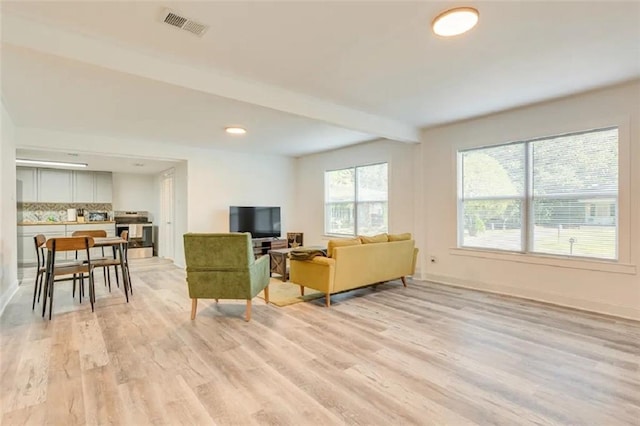 2711 Briley St, Mobile, AL 36606 - living area with light wood-type flooring, recessed lighting, and beam ceiling