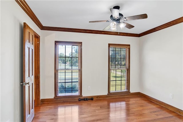 unfurnished room featuring crown molding, light hardwood / wood-style flooring, and ceiling fan