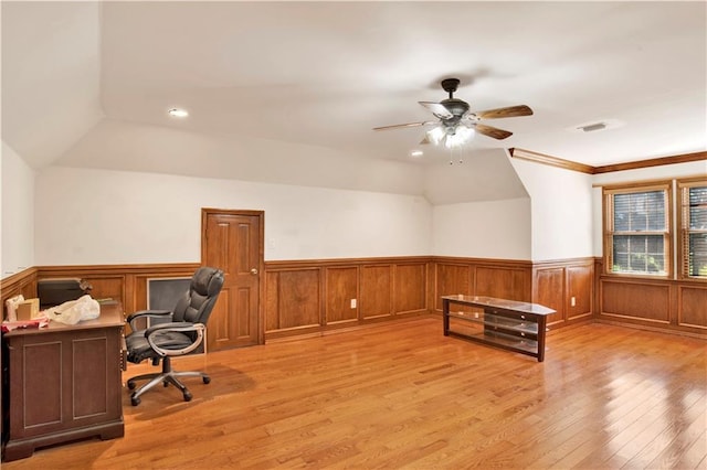 home office featuring crown molding, light wood-type flooring, and ceiling fan