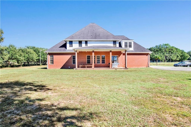 back of house with a yard