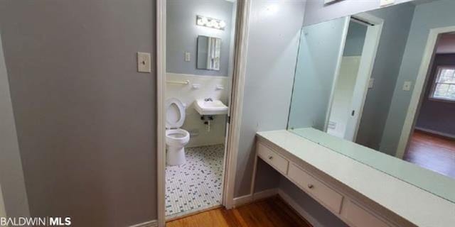 317 Syracuse St, Mobile, AL 36608 - bathroom featuring wood finished floors and toilet