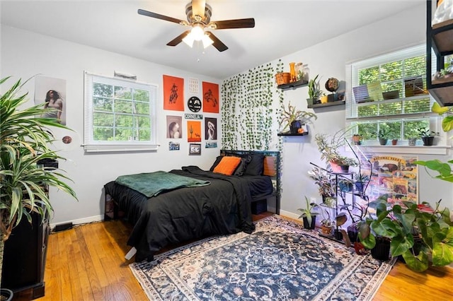317 Syracuse St, Mobile, AL 36608 - bedroom featuring multiple windows, wood finished floors, and baseboards