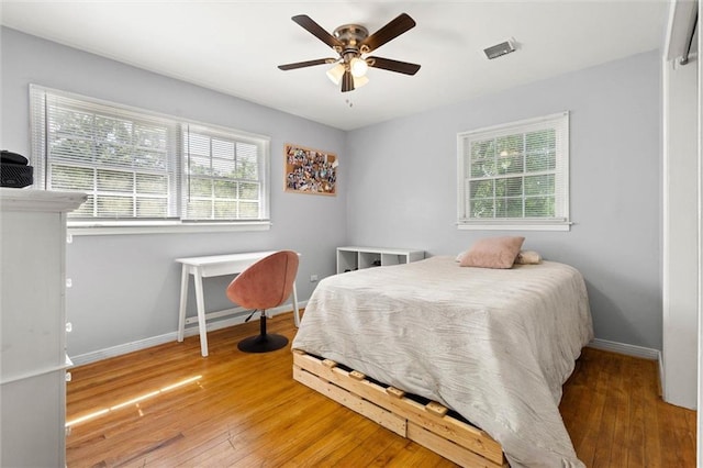 317 Syracuse St, Mobile, AL 36608 - bedroom featuring hardwood / wood-style flooring, baseboards, and ceiling fan