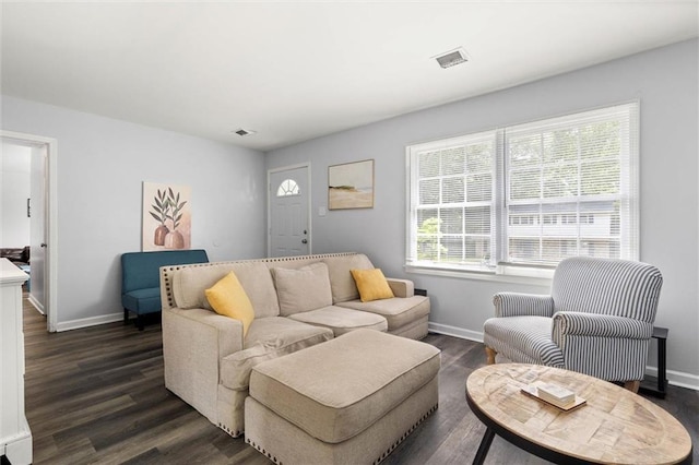 317 Syracuse St, Mobile, AL 36608 - living room featuring baseboards and dark wood-style flooring