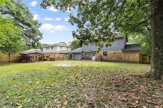 317 Syracuse St, Mobile, AL 36608 - back of house featuring brick siding and central AC unit