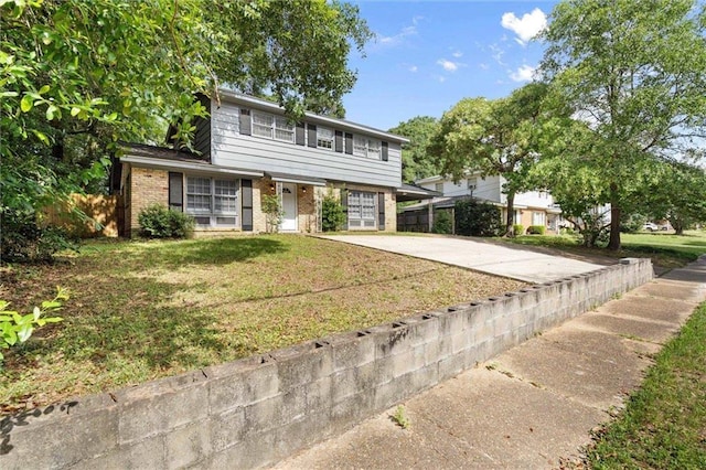 317 Syracuse St, Mobile, AL 36608 - view of front of home with concrete driveway, brick siding, and an attached garage