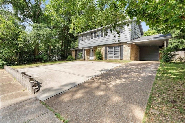 317 Syracuse St, Mobile, AL 36608 - view of front of property with brick siding, concrete driveway, and an attached carport