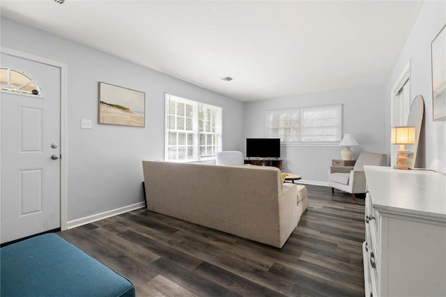 317 Syracuse St, Mobile, AL 36608 - living room featuring dark wood-style flooring and baseboards