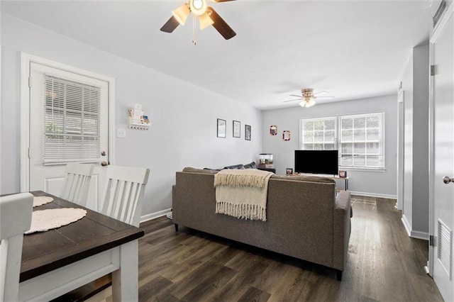 317 Syracuse St, Mobile, AL 36608 - living area featuring a ceiling fan, dark wood-style flooring, and baseboards