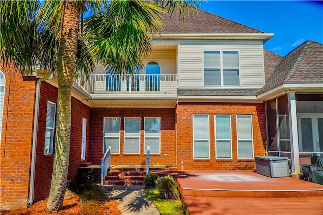 2801 Dog River Rd, Theodore, AL 36582 - rear view of house featuring a balcony and brick siding