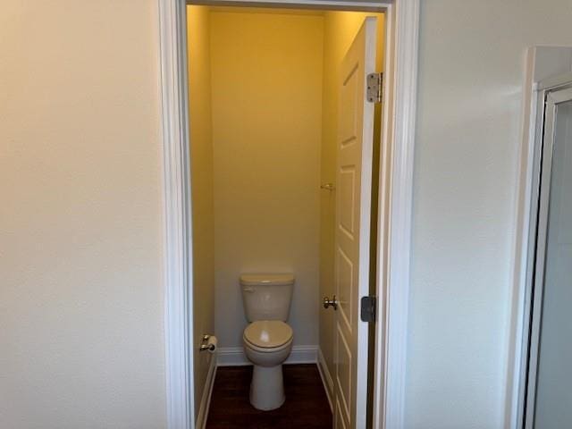 6857 Spaniel Dr Unit A, Daphne, AL 36527 - bathroom featuring toilet, baseboards, and wood finished floors