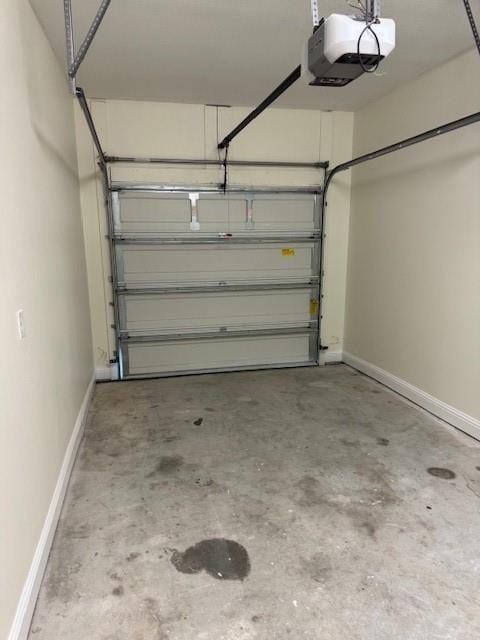 6857 Spaniel Dr Unit A, Daphne, AL 36527 - garage with a garage door opener and baseboards