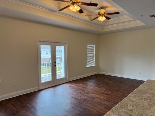 6857 Spaniel Dr Unit A, Daphne, AL 36527 - unfurnished room featuring ornamental molding, a tray ceiling, ceiling fan, dark wood-style floors, and french doors