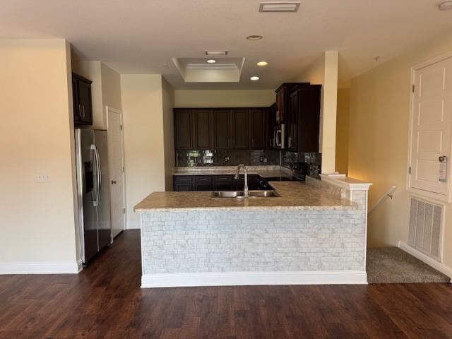 6857 Spaniel Dr Unit A, Daphne, AL 36527 - kitchen featuring appliances with stainless steel finishes, a sink, a peninsula, dark wood-style flooring, and dark brown cabinets