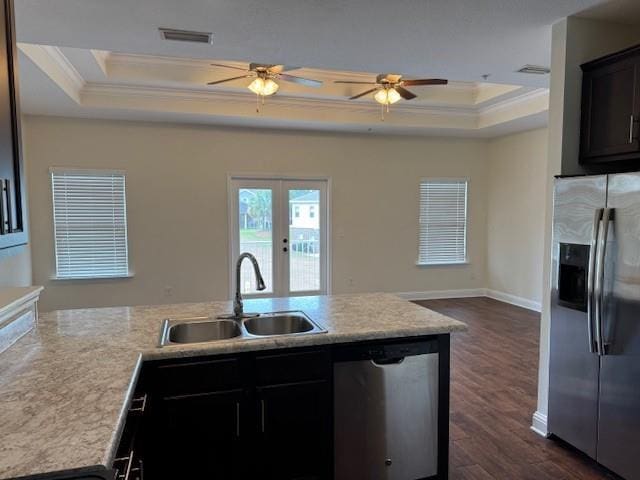 6857 Spaniel Dr Unit A, Daphne, AL 36527 - kitchen with appliances with stainless steel finishes, a raised ceiling, a sink, ornamental molding, and open floor plan