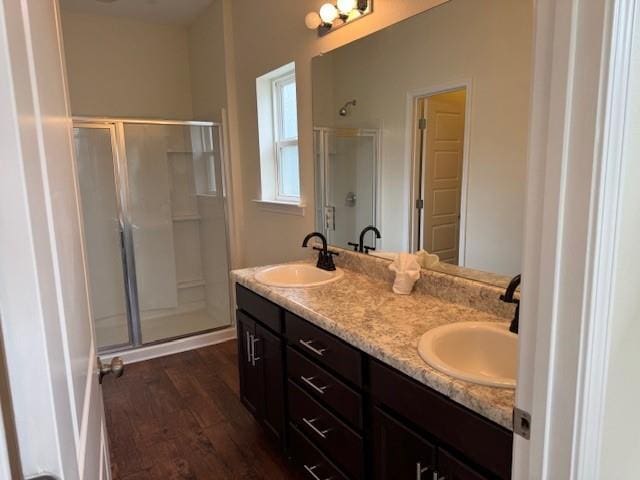 6857 Spaniel Dr Unit A, Daphne, AL 36527 - full bath featuring a shower stall, double vanity, and wood finished floors