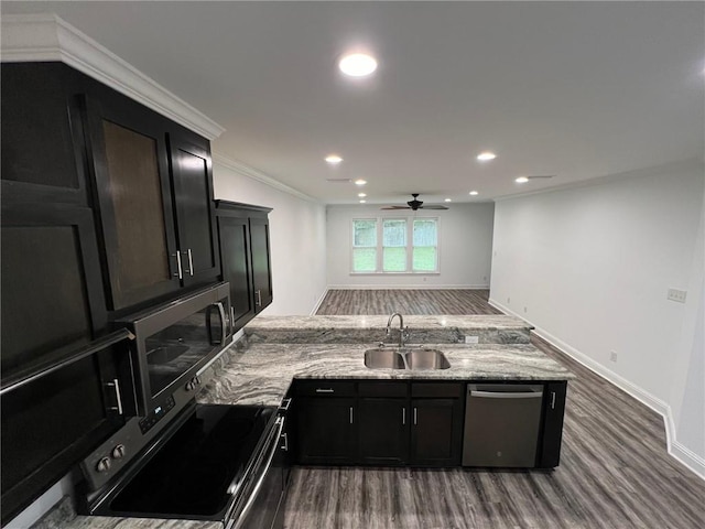 kitchen with sink, ceiling fan, ornamental molding, light stone counters, and stainless steel appliances