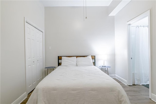 bedroom with a closet and light wood-type flooring