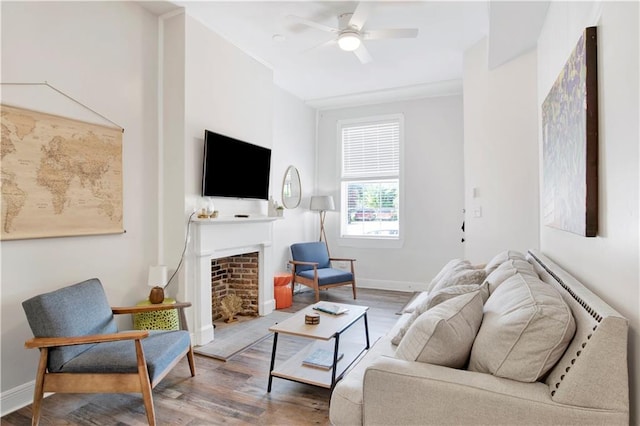 living room with ceiling fan and hardwood / wood-style floors